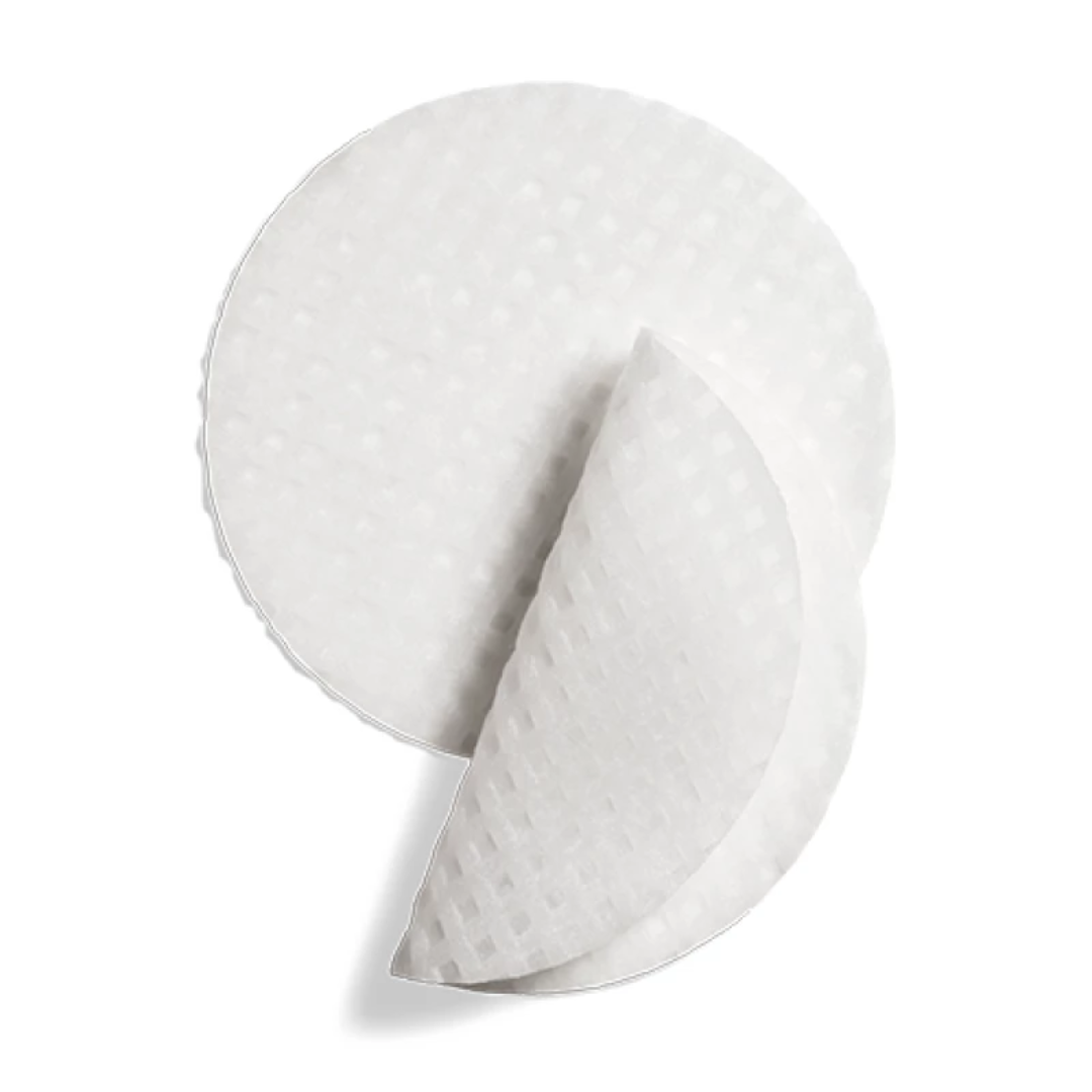 Two round white textured complexion renewal pads on a white background