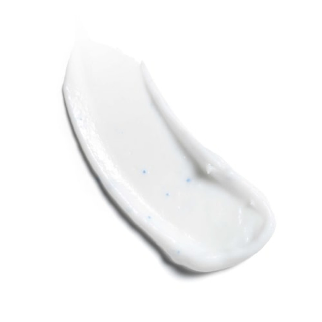 smear of white cream with blue microbeads on white background, skincare or cosmetic product texture