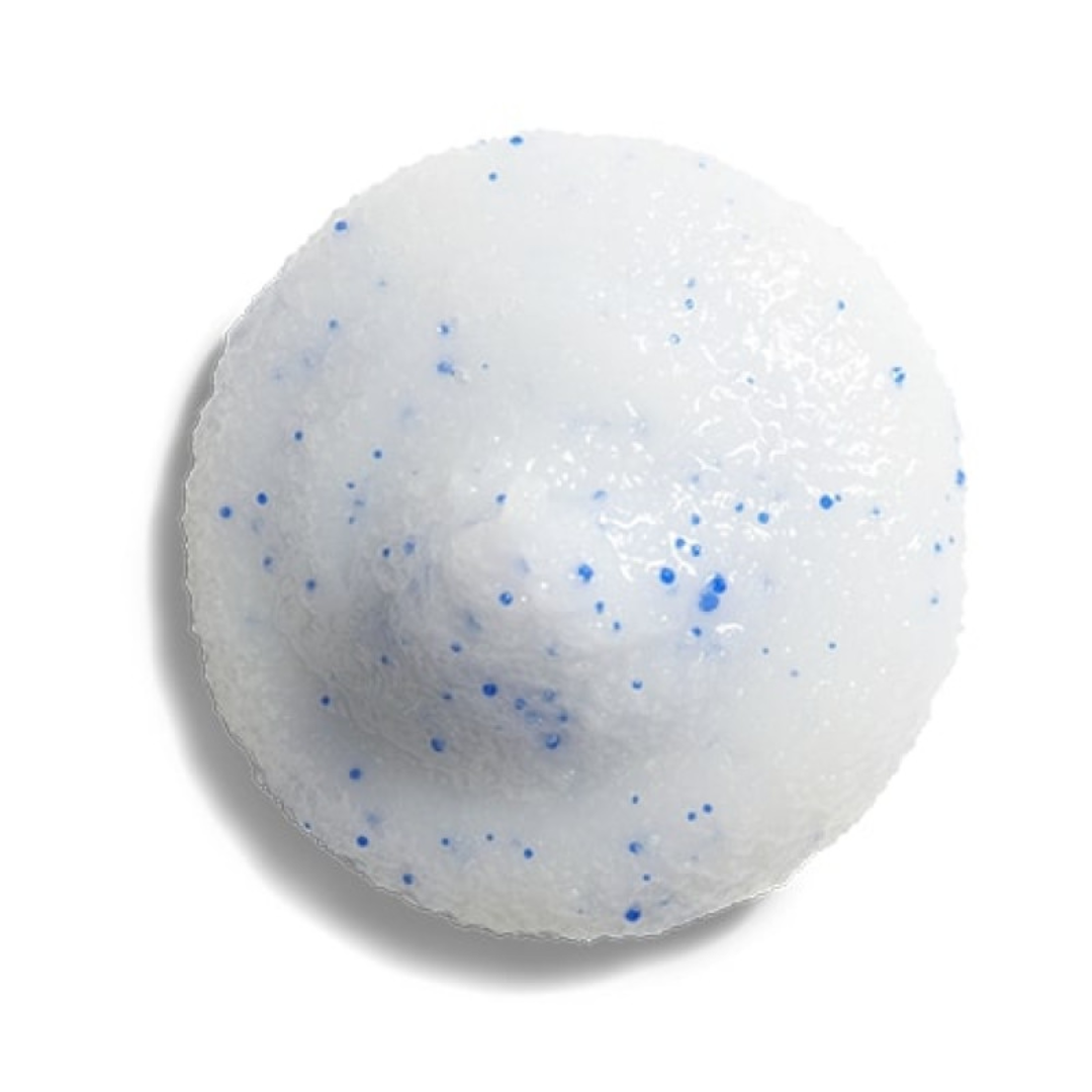Close-up of white cosmetic scrub drop with blue exfoliating beads on white background