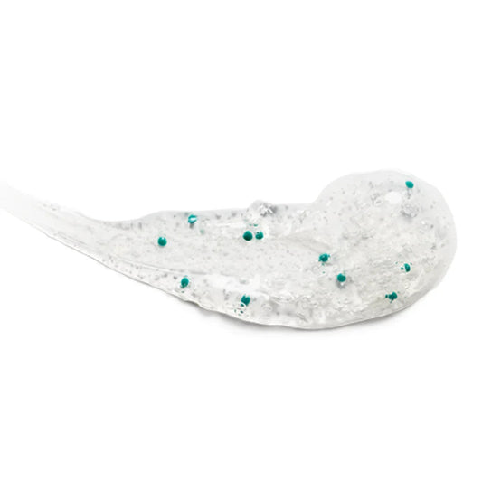 Clear exfoliating gel with small green beads for normal to oily skin on white background