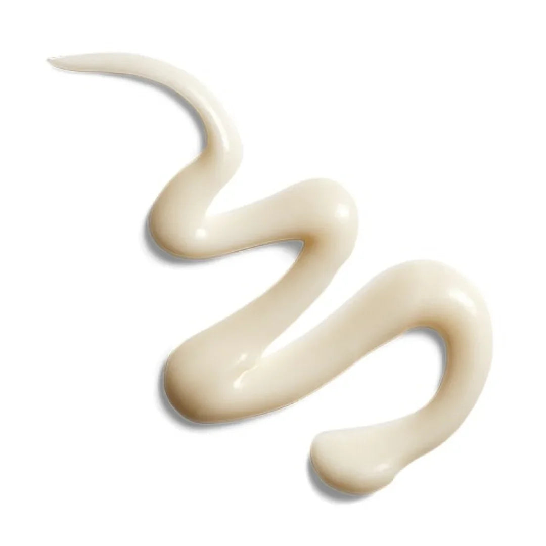 Creamy beige eye brightening cream swatch on white background