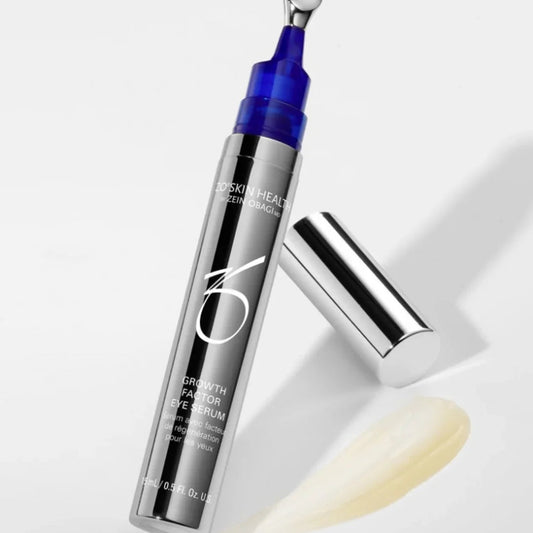 ZO Skin Health Growth Factor Eye Serum in metallic bottle with blue applicator and cream smear