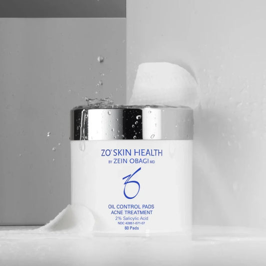ZO Skin Health Oil Control Pads acne treatment jar with water splashes and textured pads