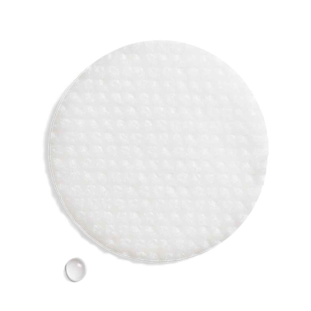 White circular oil control pad with textured surface and a water droplet on white background