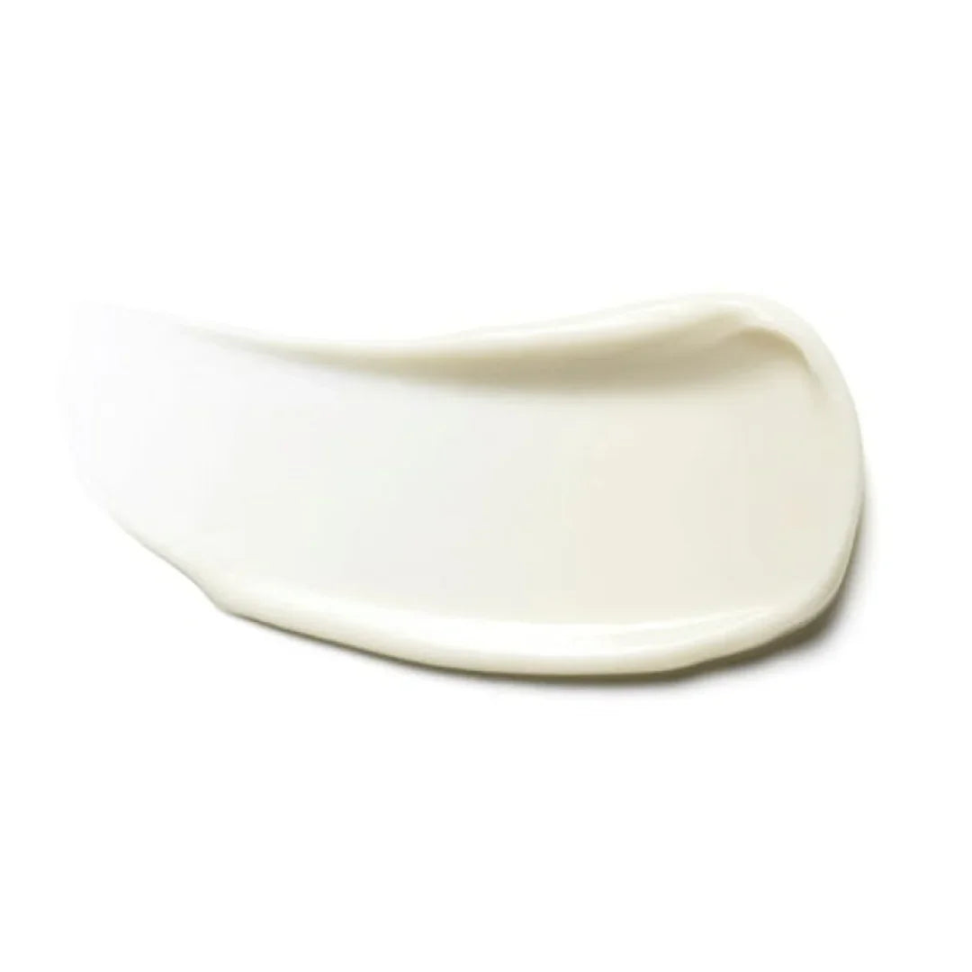 Smooth white skincare cream texture swatch on white background