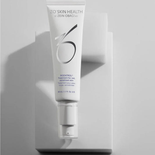 ZO Skin Health Rozatrol serum tube for red, sensitized skin on white geometric platform