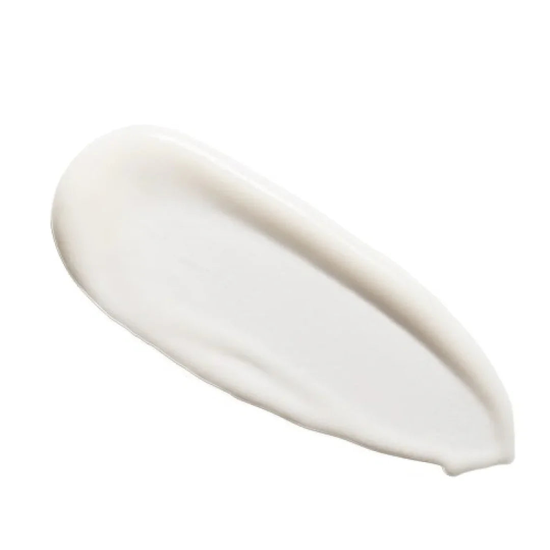 Smear of white cream or serum with smooth texture on white background